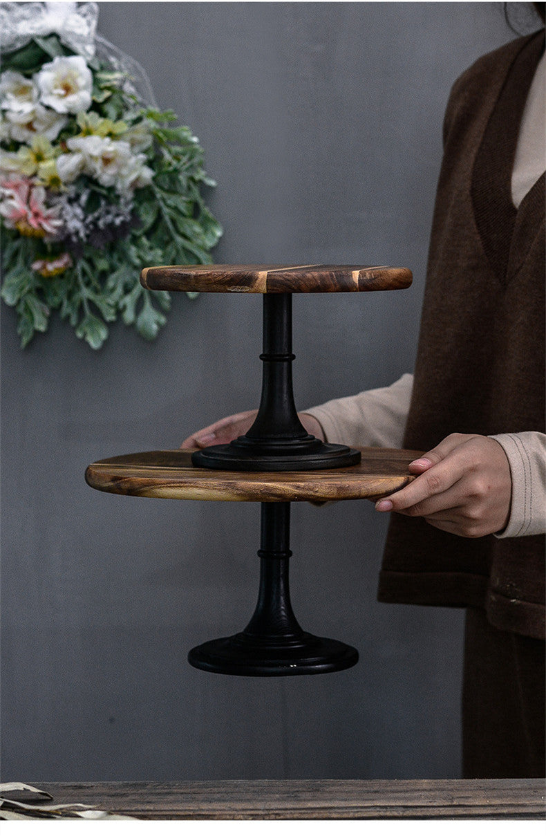 Elegant solid Acacia wood cake stand used as a rustic centerpiece for desserts and appetizers.