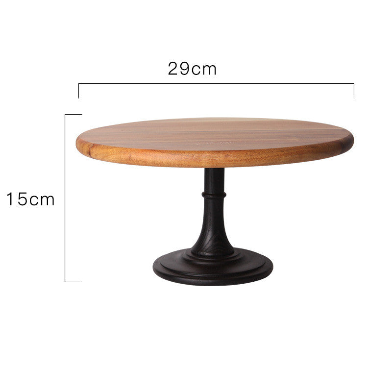 Elegant solid Acacia wood cake stand used as a rustic centerpiece for desserts and appetizers.