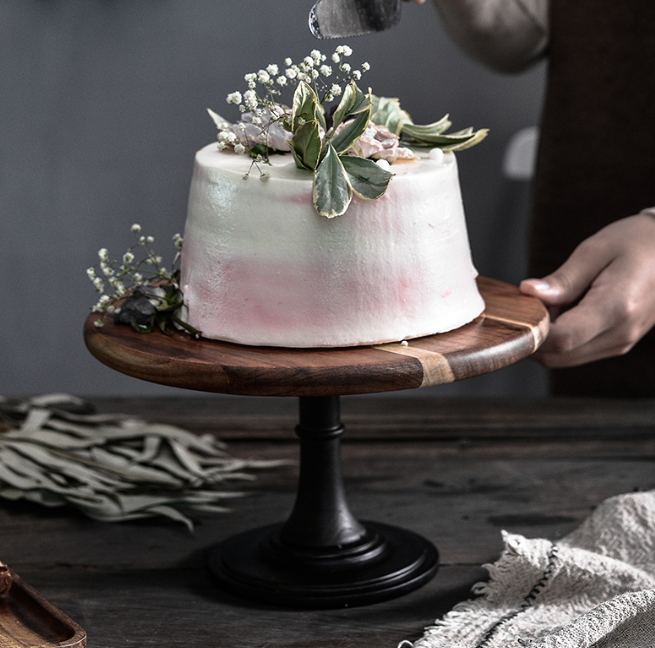 Elegant solid Acacia wood cake stand used as a rustic centerpiece for desserts and appetizers.