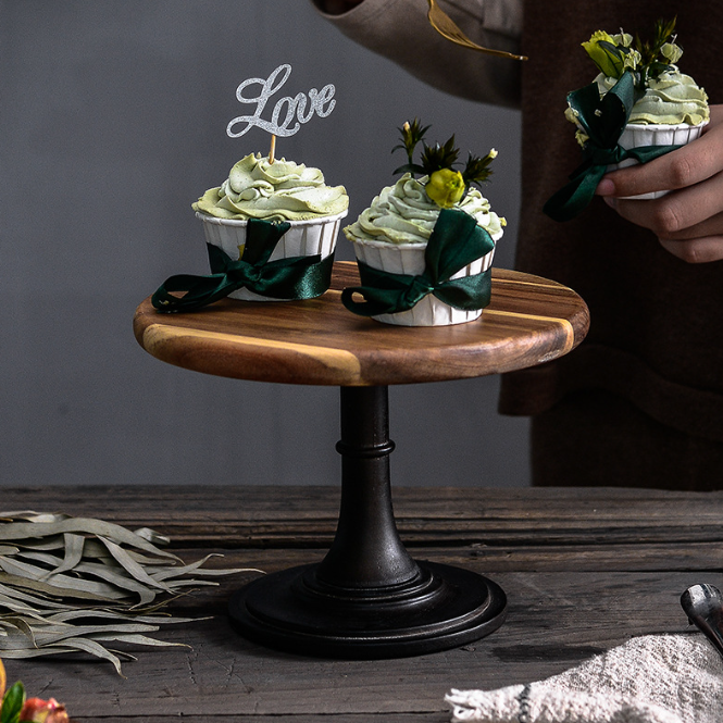 Elegant solid Acacia wood cake stand used as a rustic centerpiece for desserts and appetizers.
