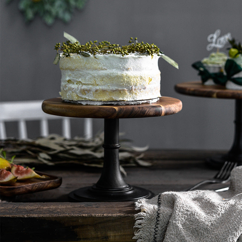 Elegant solid Acacia wood cake stand used as a rustic centerpiece for desserts and appetizers.